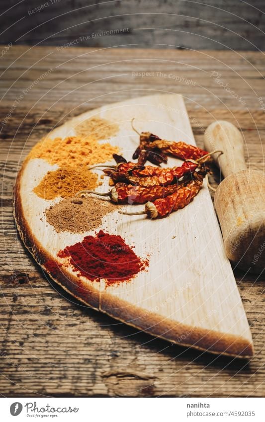 Still life of exotic and hot spices spicy indian arabic tumeric ginger powder pepper chilly ingredient garlic nutmeg cayenne tasty art artistic rustic rural