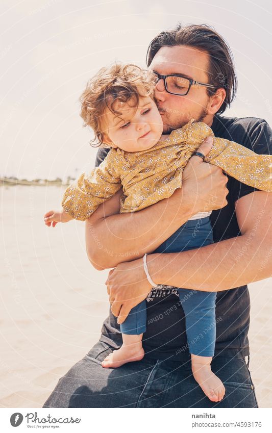 Single dad hugging her baby in their holidays father fatherhood single vacation summer girl love together warm warmth sun sunny outdoors nature life lifestyle