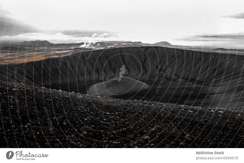 Landscape of wide extinct volcano crater volcanic wildlife rock round landscape formation basalt cloudy north cold mountain mineral tuff massive uninhabited