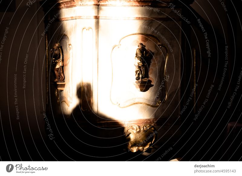 The sun shines on the pulpit in the church.  The photographer can be seen in front of it as a shadow. Sanctuary Church Interior shot Architecture Deserted