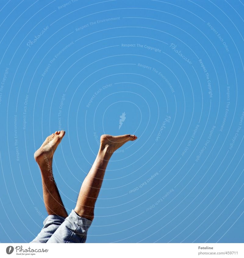 high up Human being Masculine Man Adults Legs Feet Sky Cloudless sky Summer Bright Blue Calf Toes Jeans Colour photo Multicoloured Exterior shot Detail