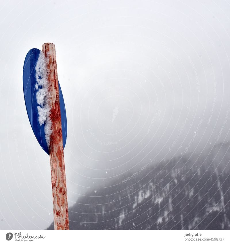 Blue sign in winter landscape Signs and labeling Red Landscape Winter Snow Cold chill Slope Mountain Tyrol Frost Fog Contrast Winter sports Clue Signage Warn