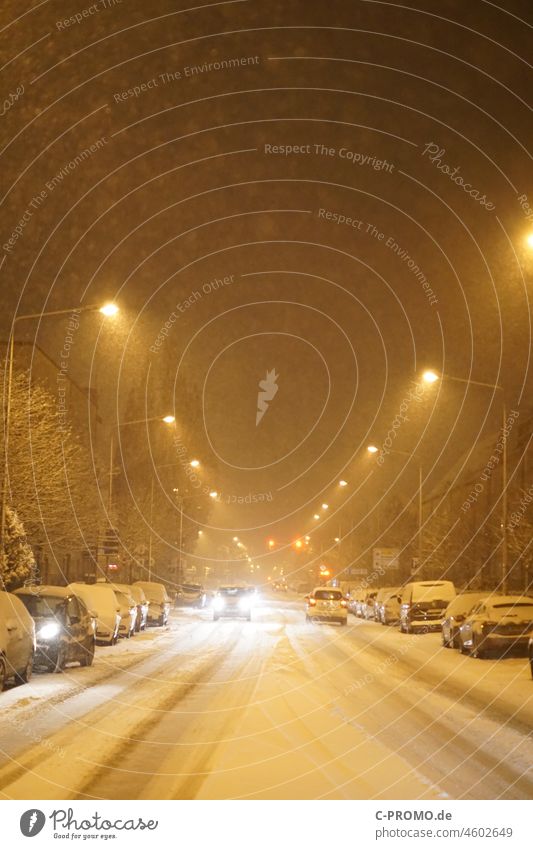 Winter onset in city Street vehicles Town onset of winter lanterns Light Night snow-covered Floodlight winter tyres Smoothness Snowfall snow chaos