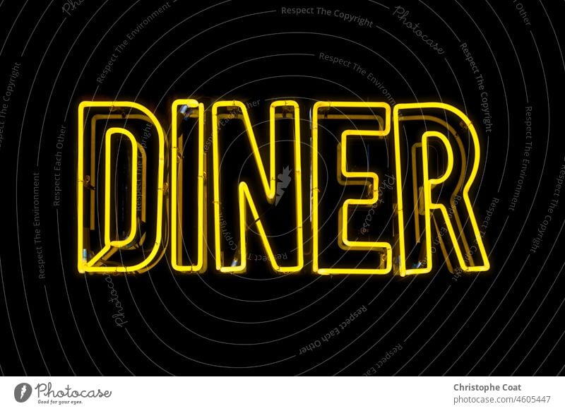 Close-up on a neon light shaped into the word "Diner". USA Capital Letter Commercial Sign Communication Concepts Food And Drink Industry Food Bar Food and Drink