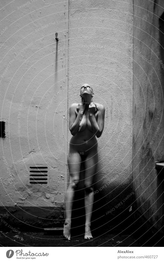 naked woman stands in the courtyard and stares up into the light Interior courtyard Young woman Youth (Young adults) Body Breasts Legs Feet 18 - 30 years Adults