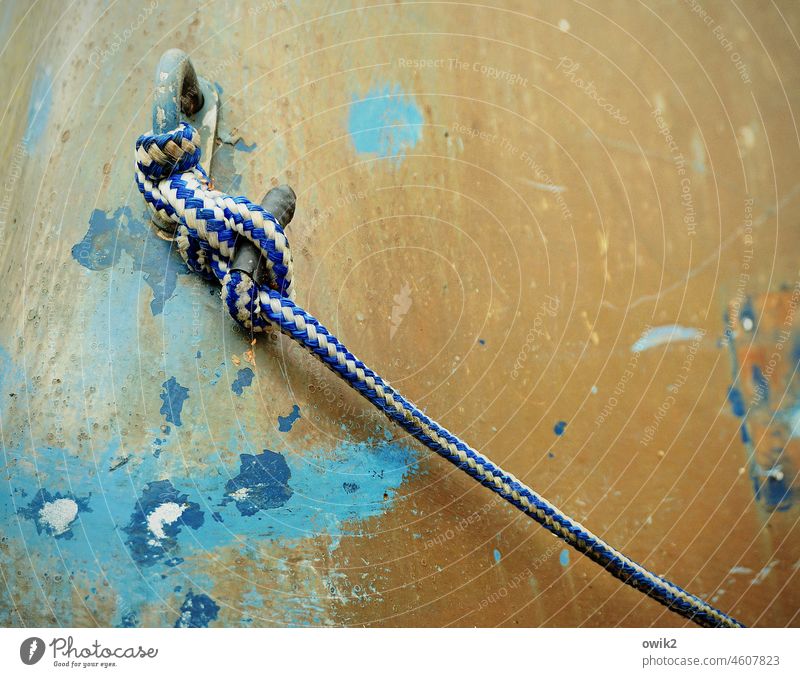 Tightly lashed Rope Plaited Plastic Calm Hull Detail Fishing boat Peaceful Idyll Rowboat Rest position Motionless Orange Yellow Turquoise Firm Close-up