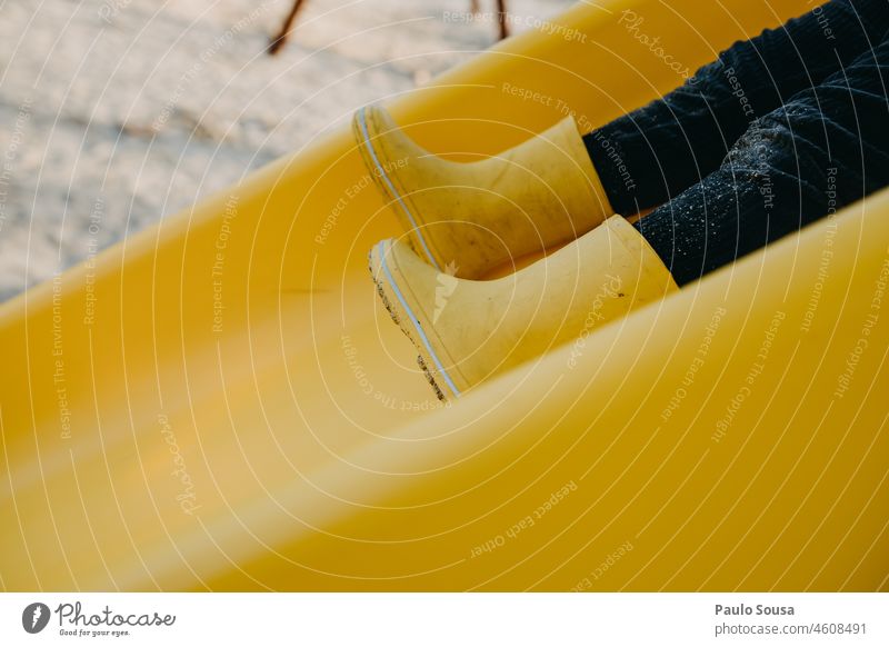 Close up Yellow rubber boots Close-up Yellowed Rubber boots Weather Multicoloured Exterior shot Wet Rain Boots Colour photo Water Human being Infancy Puddle Joy