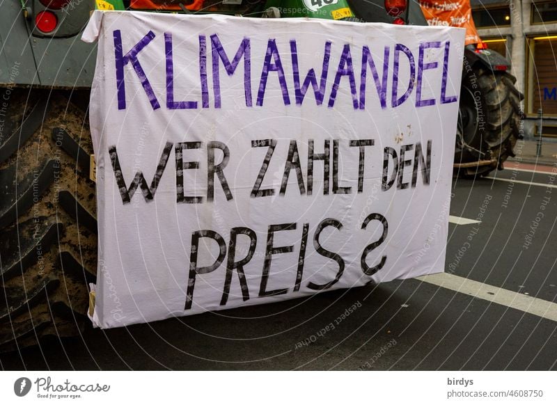 Climate change. Who pays the price ? Writing on a climate demonstration Global warming CO2 emission Impact natural disasters Demonstration Characters question