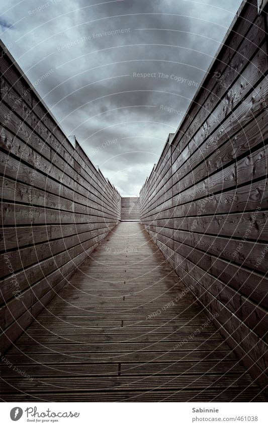 Wall, there's a light at the end of the tunnel. Sky Clouds Bad weather Manmade structures Architecture Wall (barrier) Wall (building) Roof Gloomy Distress