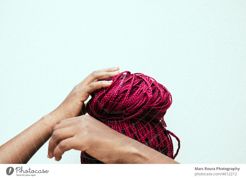 red braids on a white background african american attractive beautiful black woman braids updo brunette bun casual cheerful close-up colorful