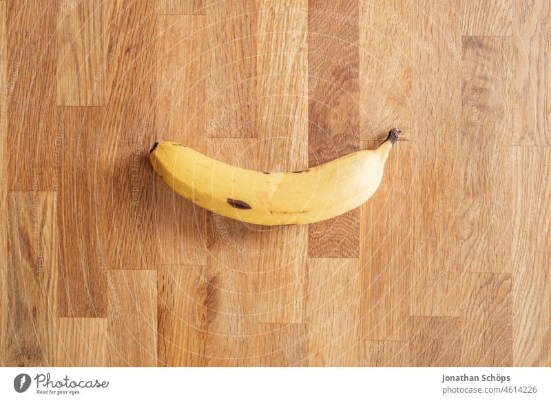 Banana flatlay on wood texture plan Fasting fasting Wood Wood texture Wooden table minimalism fruit reduction Still Life tropical fruit Yellow cute vegan