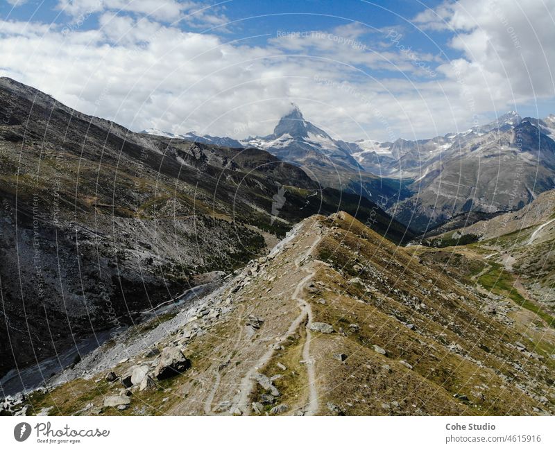 View of the Matterhorn in Switzerland Alps Italy Zermatt Nature Landscape Mountain Glacier Sky Clouds hike Hiking trekking view Valley Outdoors travel explore