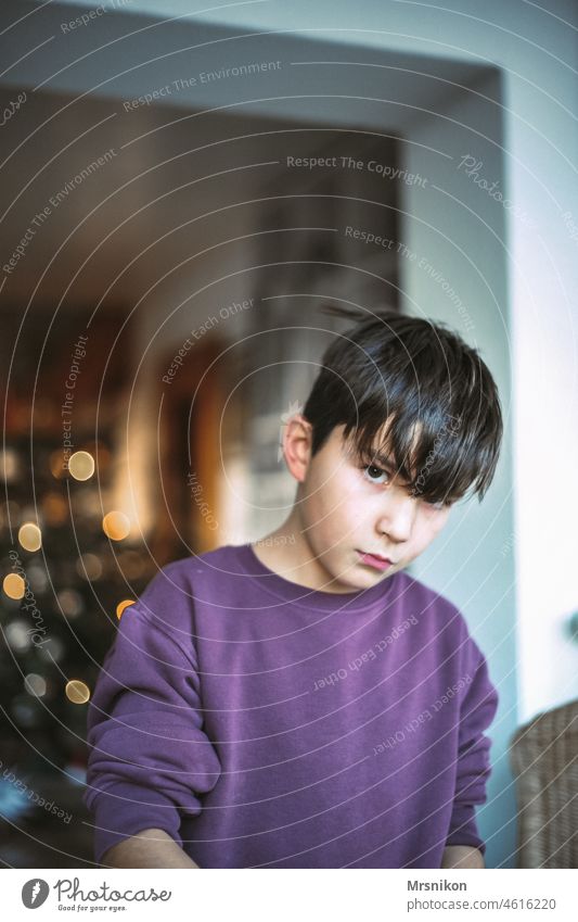 Boy Christmas Boy (child) Christmas party on one's own grumpy Earnest Seriousness brown hair Infancy Winter at home