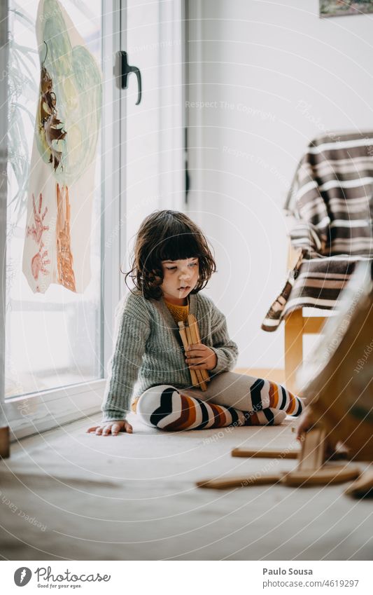 Cute girl playing with wooden toys at home Girl 3 - 8 years Child childhood Infancy Colour photo Lifestyle Happy Childhood memory Day Multicoloured