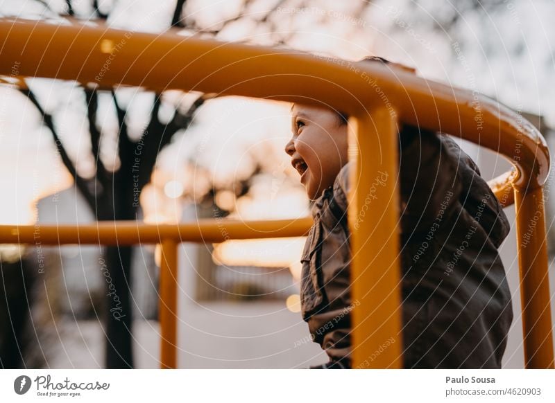 Cute boy playing on playground Boy (child) childhood Child Happy Happiness Smiling smile Playground playground equipment Infancy Playing Kindergarten Joy Park