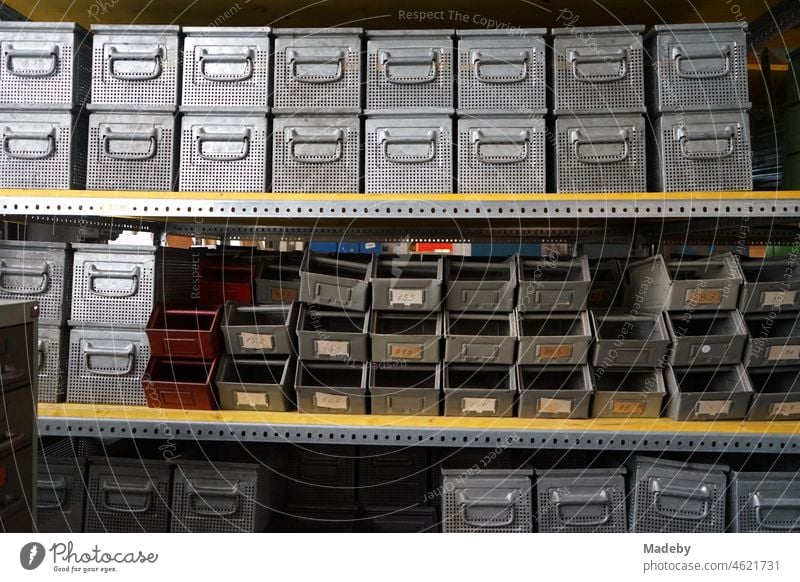 Old shelf in a warehouse with boxes and boxes for small parts in a former factory building in the district of Margaretenhütte in Giessen on the river Lahn in Hesse, Germany