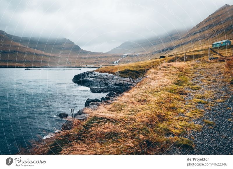 Faroe Islands: View of coast and mountains in fog Holiday season Rural Landscape Picturesque highlands Cold Mountain Sunlight idyllically stunning Rock Peaceful