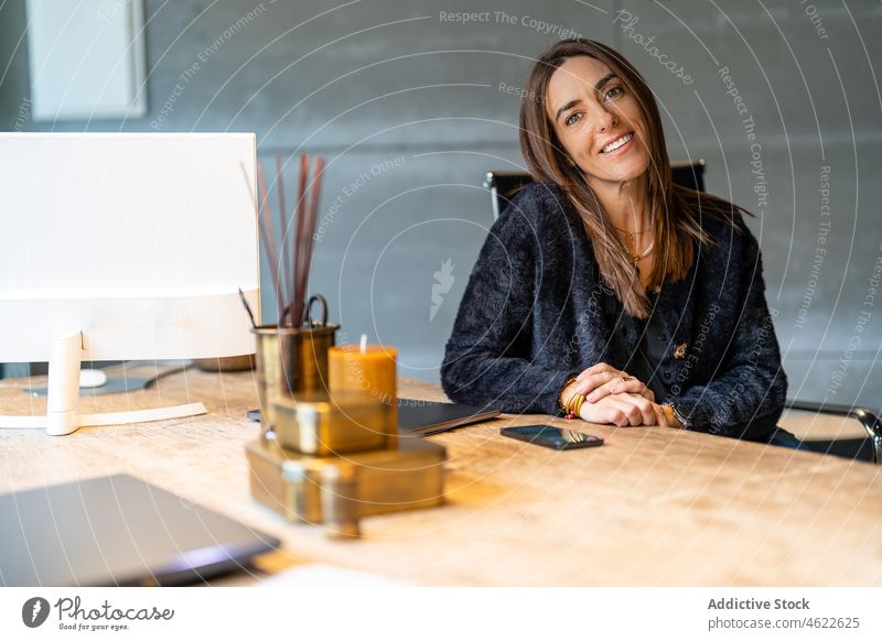 Positive woman sitting at desktop workplace style modern office portrait entrepreneur worker business job positive lady professional workspace computer female