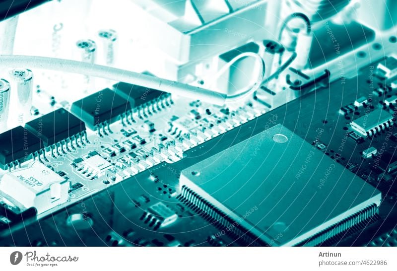 Electronic circuit board. Semiconductor motherboard circuit board technology. Mainboard of computer. Integrated semiconductor microchip on green circuit board. Hi-tech industry and computer science.