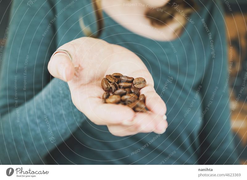 Woman hand holding natural coffee grains food organic integral map world import export exportation importation granel woman bio eco organic food tasty flavour