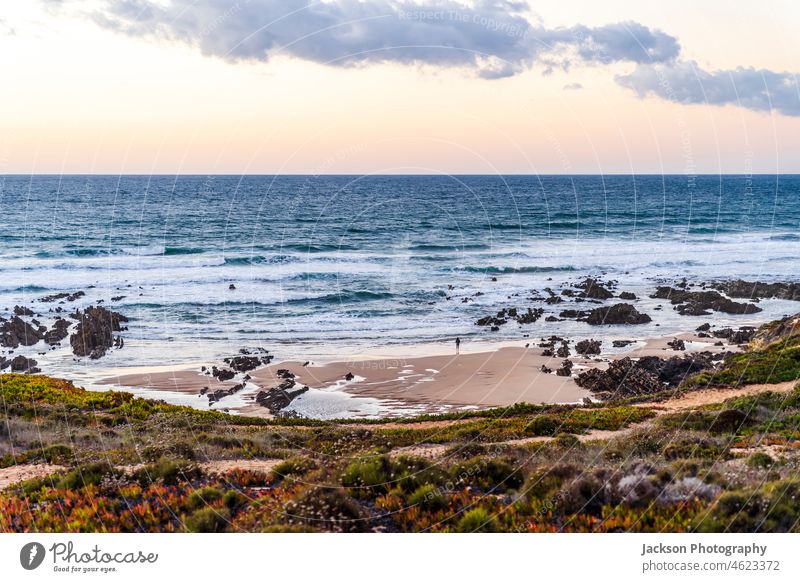 Nossa Senhora Beach in Almograve Lonqueira at sunset, Alentejo, west of Portugal holiday ocean water blue landscape vacation sand beautiful outdoor travel sea