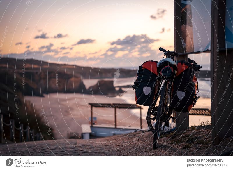 Bicycle with bags by the Almograve beach, Alentejo, Portugal bicycle bike sport alentejo almograve moody recreation coastline seaside copy space costa vicentina