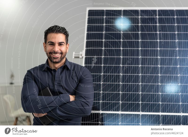 Solar energy seller posing near to panel in office solar worker businessman suit people handsome person success confident manager smile executive standing