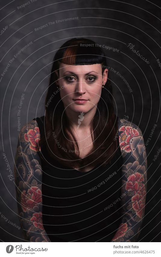 heavily tattooed woman - portrait Tattoo Woman pretty Bangs feminine Feminine Long-haired Looking stop Adults Looking into the camera Authentic Piercing