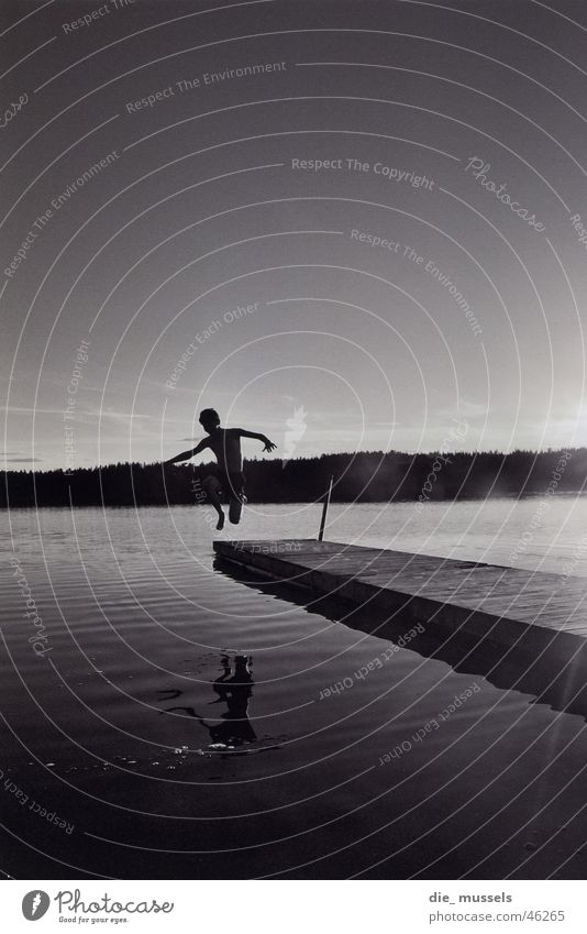 jump into the wet Lake Jump Footbridge Water Black & white photo Sweden