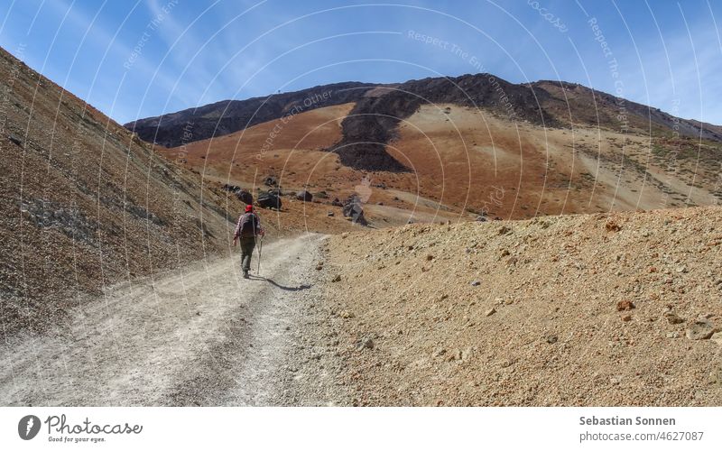 Hiker in Teide National Park of Tenerife Volcano hikers travel Woman Nature Hiking Picturesque naturally Stone Mountain Human being Landscape rocky Tourism Rock