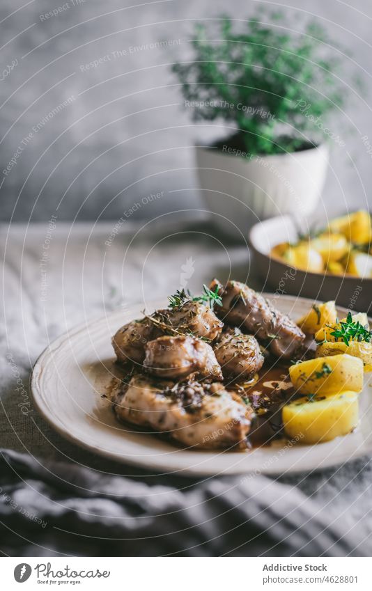 Tasty rabbit stew with potatoes in plate on table meat serve dinner tasty fresh meal food dish cuisine delicious bowl tradition appetizing nutrition gourmet