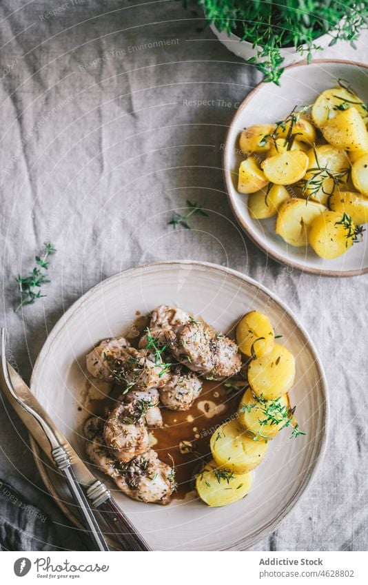 Tasty rabbit stew with potatoes in plate on table meat serve dinner tasty fresh meal food dish cuisine delicious bowl tradition appetizing nutrition gourmet