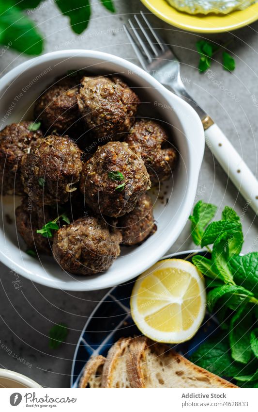 Tasty keftethes in bowl on table meat traditional greek dish cuisine culinary meatball food meal delicious tasty serve palatable lunch delectable kitchen yummy