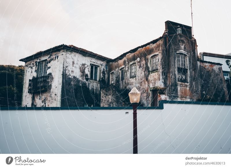 Historical house with wall in Azores Central perspective Deep depth of field Sunlight Reflection Contrast Shadow Copy Space middle Copy Space bottom