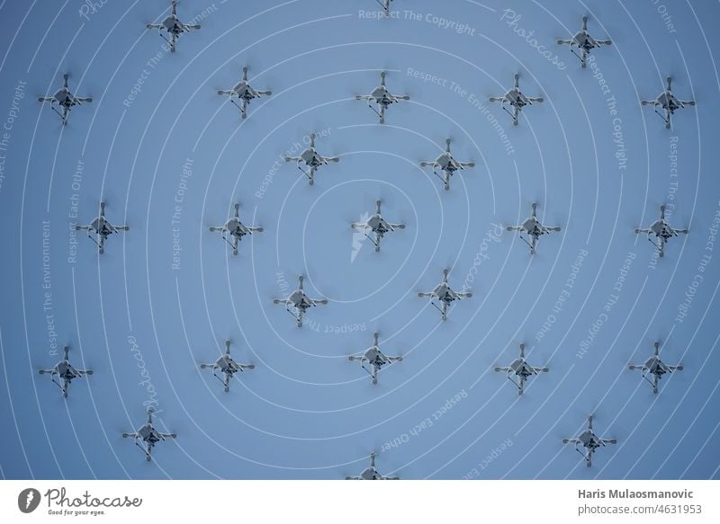 synchronized drones in formation in the air a lot aircraft airplane antenna artificial intelligence blue camera close control digital fast flight fly group home