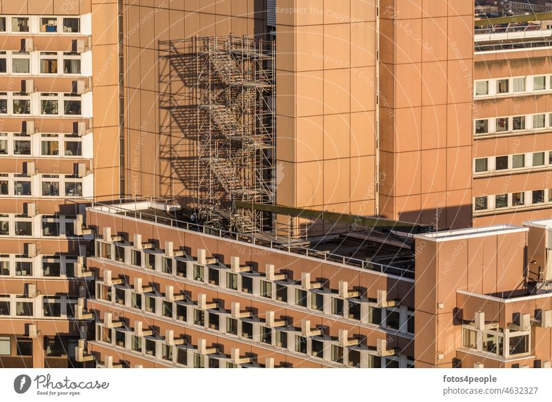 Justice center Cologne with scaffolding Scaffolding Warm colour Pattern lines White Window Square tribunal Building High-rise County court District Court