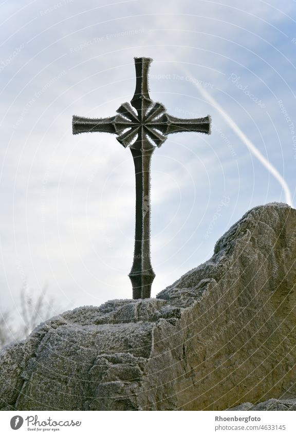 Iron cross fixed on a small rock with hoarfrost Crucifix religion Rock Stone hand forged Belief symbol Winter winter Frost Church Catholic Park memorial stone