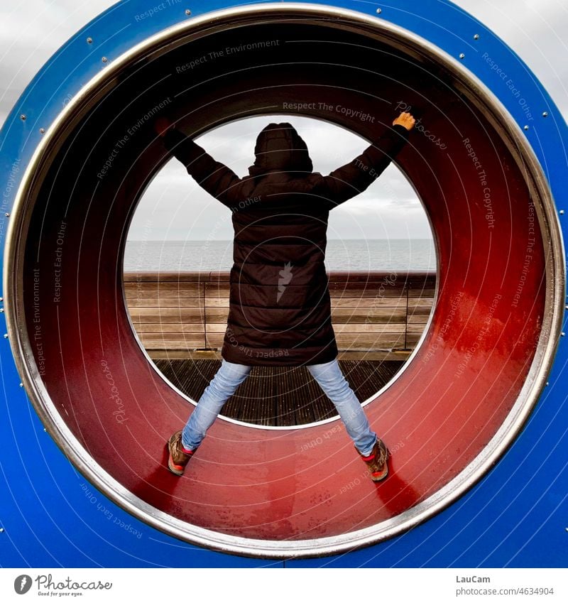 Stress relief - tunnel vision with focus on the calm sea Tunnel vision Woman back view stress reduction Central perspective Ocean Lake Water Circle