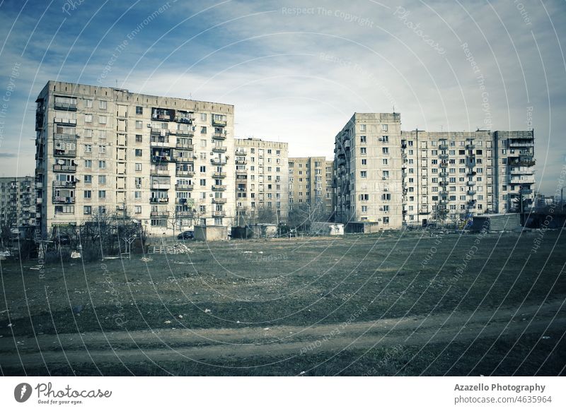 Ugly multistory residential blocks in a deserted district. Soviet architectural design. 80s architecture blue sky building city cityscape concrete construction