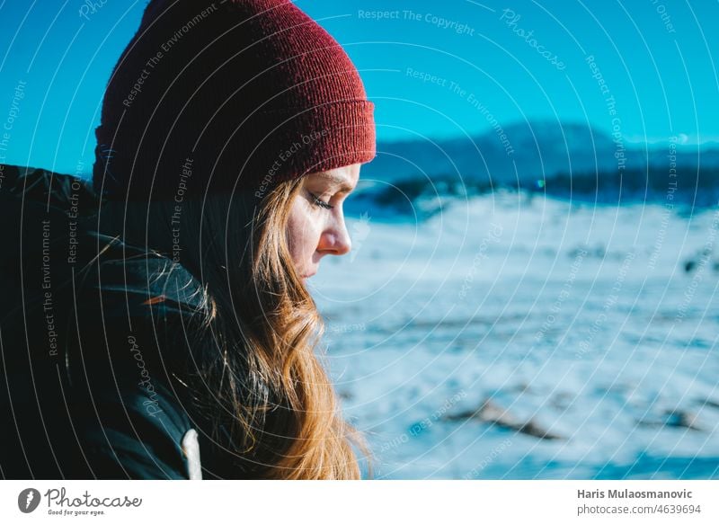 woman freezing outside on cold temperature alone background clothing extreme frosty frozen hat landscape lost mountain nature outdoor people prevent skin