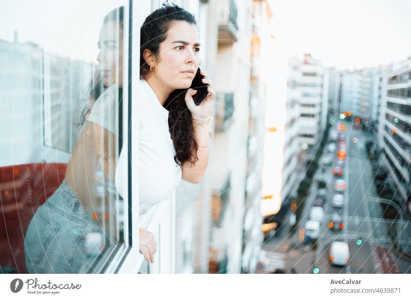 Young freelancer student wife checks his phone while working at home and receiving dad messages calls and prepares his day. concept of remote work from home, get ready, new job