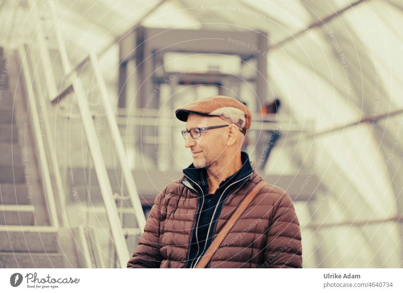 UT HH 19 | Endstation Hamburg Human being Man Train station Wait cap Eyeglasses portrait Under glass Stairs Adults View to the side