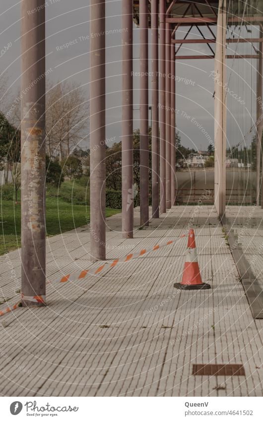 Barrier cone next to a building on the street Construction site Safety Insurance Building Architecture Wall (building) Facade Town Protection Precuation