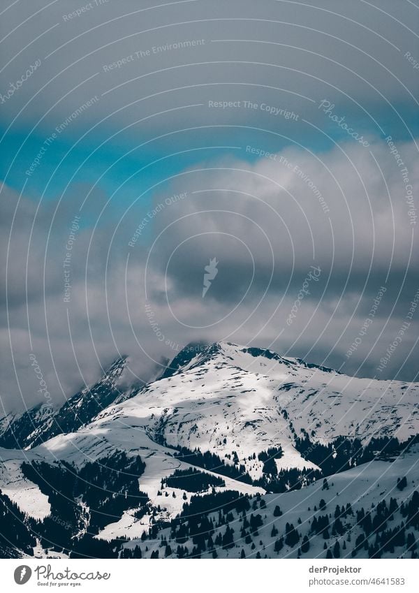 View of snow covered peaks in Neukirchen Snowscape Mountain range Panorama (View) Long shot Deep depth of field Sunlight Light (Natural Phenomenon) Reflection