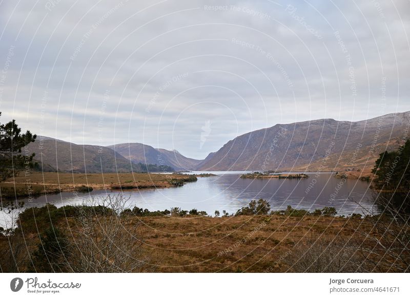 Glenveagh National Park, Co. Donegal. view of lake between mountains. Mountain scene with cloudy sky. donegal ireland outdoor dunlewey ancient lough glenveagh