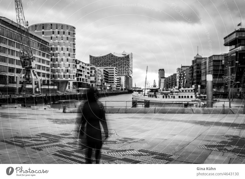 Blurred woman lonely in Hafencity (Hamburg) Town Street People Manmade structures Architecture urban Woman Going Europe Paris arrive Loneliness one person