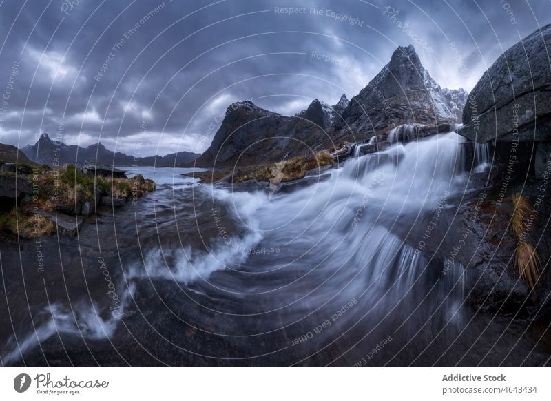 Sea flowing against rough mountain sea coast shore archipelago water nature rocky overcast boulder environment scenery marine natural scenic norway lofoten aqua