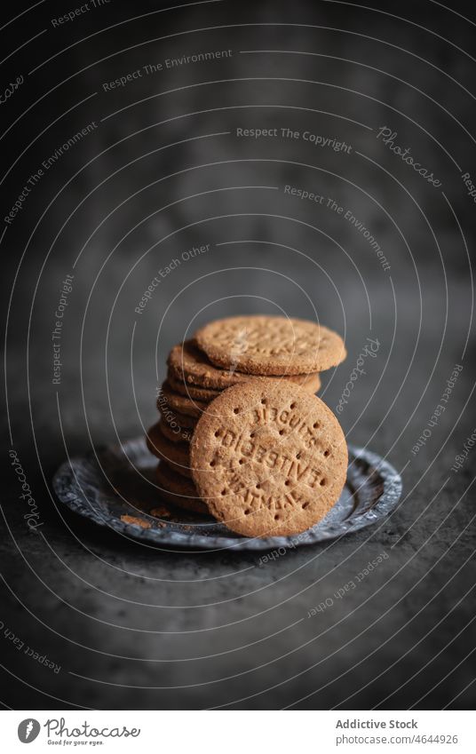 Pile of delicious sweet digestive biscuits placed on tray tasty crumb silver cookie food pastry yummy pile snack sugar baked dessert heap confectionery culinary