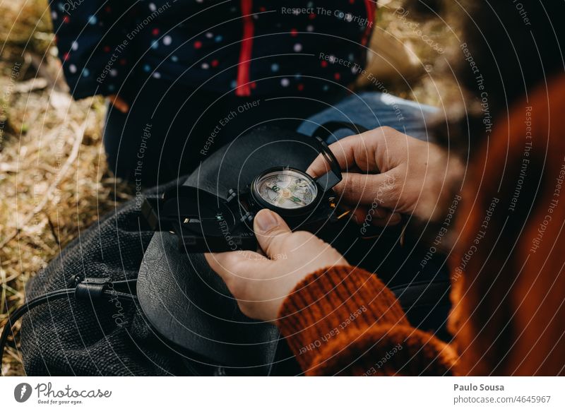 Woman holding compass navigation Compass (Navigation) Orientation Compass point Colour photo Exterior shot Target Hiking Adventure Lanes & trails