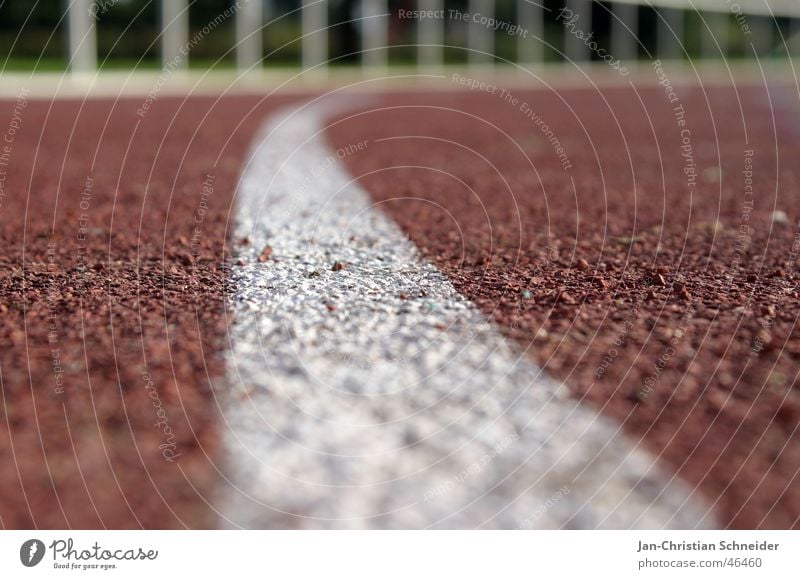 Raceway 3 Red Stripe White Sun Light Subsoil Sporting event Resume Sportsperson Walking Shadow Floor covering Row Railroad Line